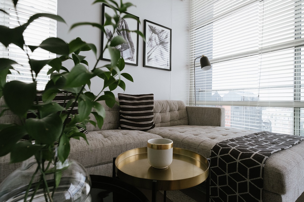 living room with sectional and plant
